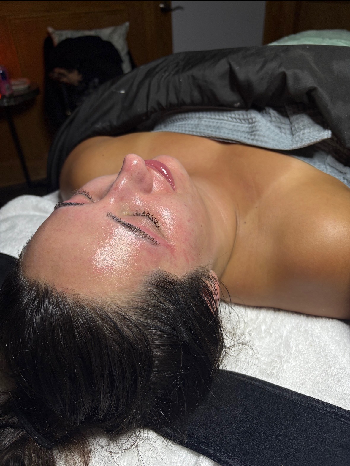 Post-facial glow on a client following a customized skincare treatment by Crawfordville esthetician. Treatment included a double cleanse, steam and exfoliating enzyme, dermaplaning, extractions, brow wax, nourishing products, facial massage, and a soothing mask. Finishing products included hyaluronic acid serum, vitamin c serum, eye cream, and SPF.